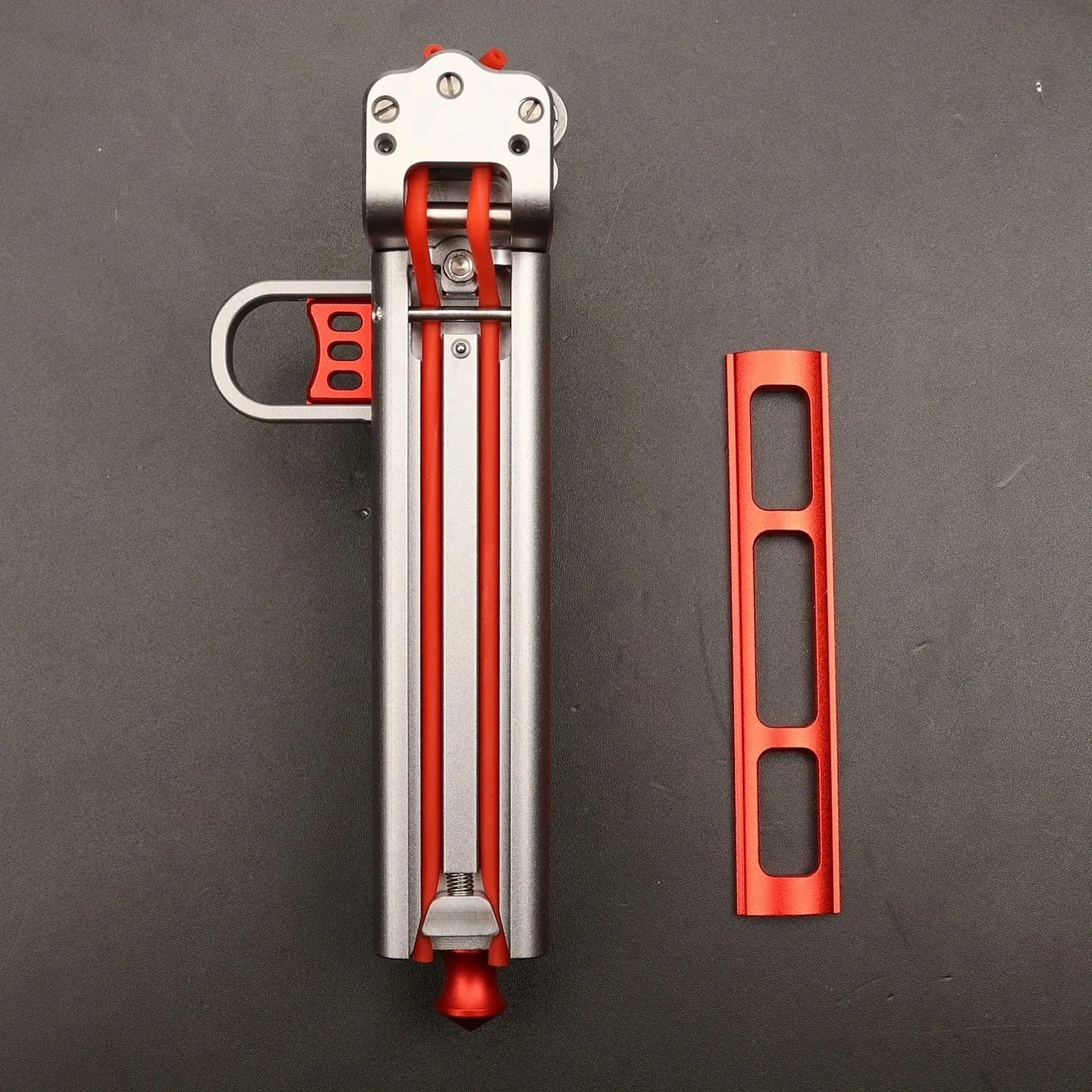 CNC aluminium alloy automatic slingshot frame beside its detachable 17 cm magazine