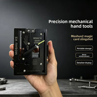 Magic pivot folding slingshot closed into a flat metal card, held in one hand