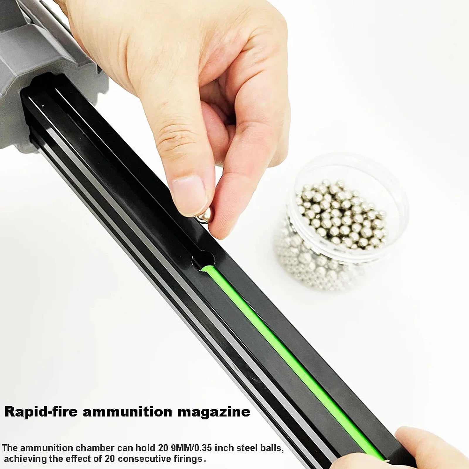 Loading 9 mm steel balls into the slingshot rifle's 20-round rapid-fire chamber