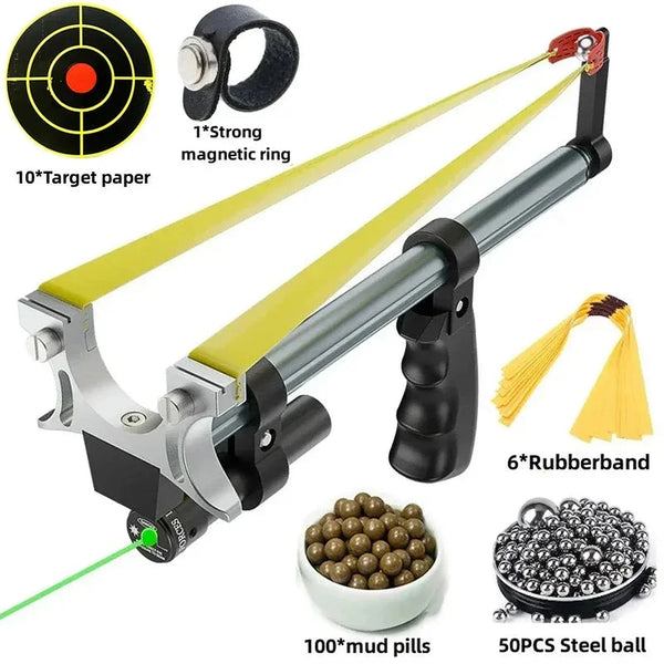 Slingshot rifle with laser sight in green, shown with target paper, clay pills, steel balls and spare bands